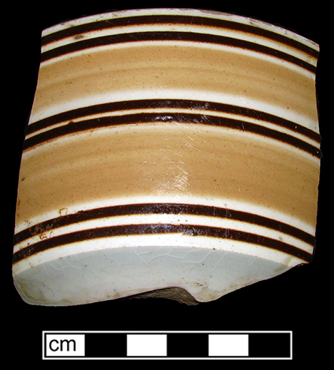 Bowl banded in pale orange and brown, London-shape.
